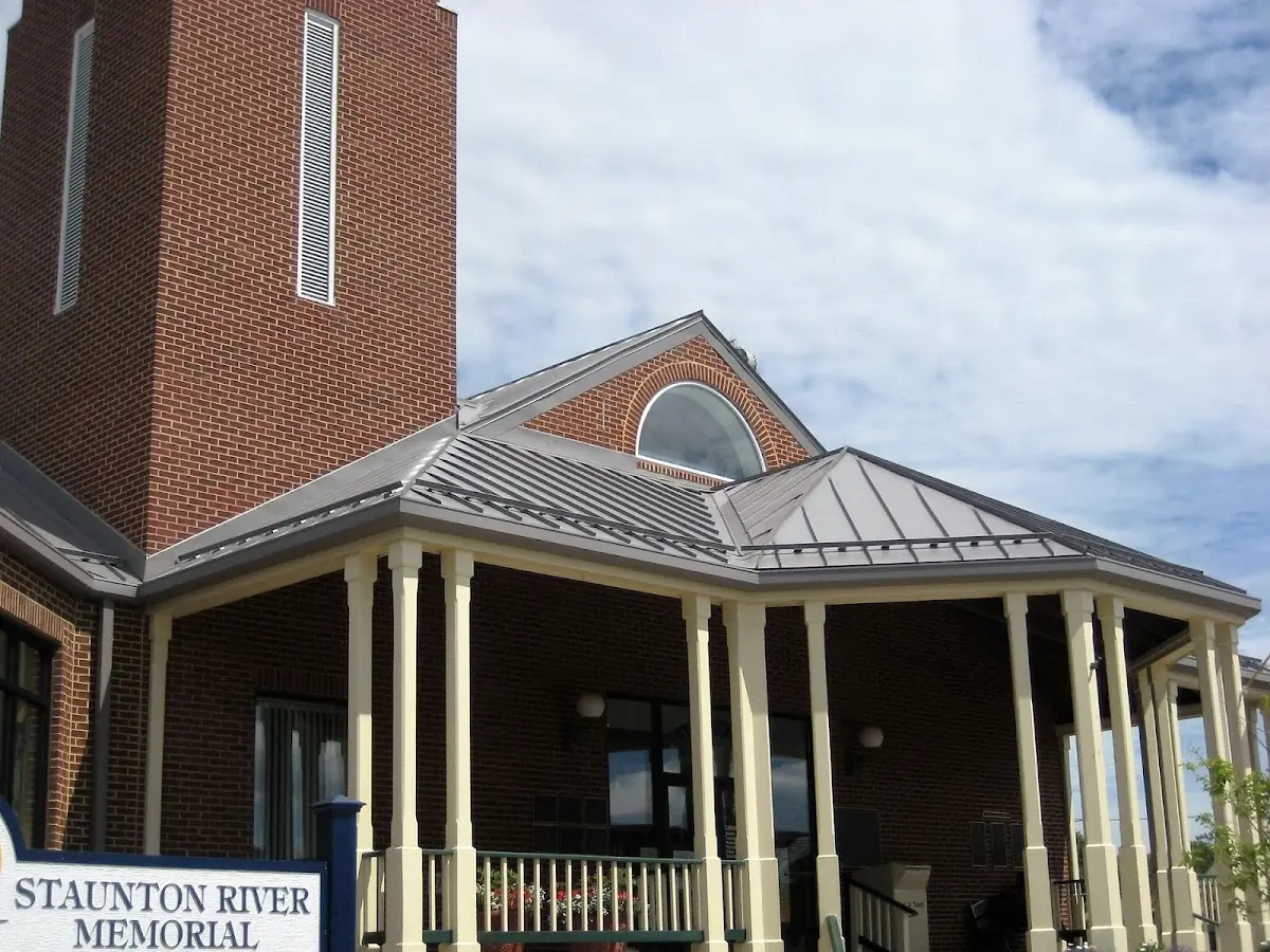 Skilled roofing craftsmen working on a residential roof in Tully Center